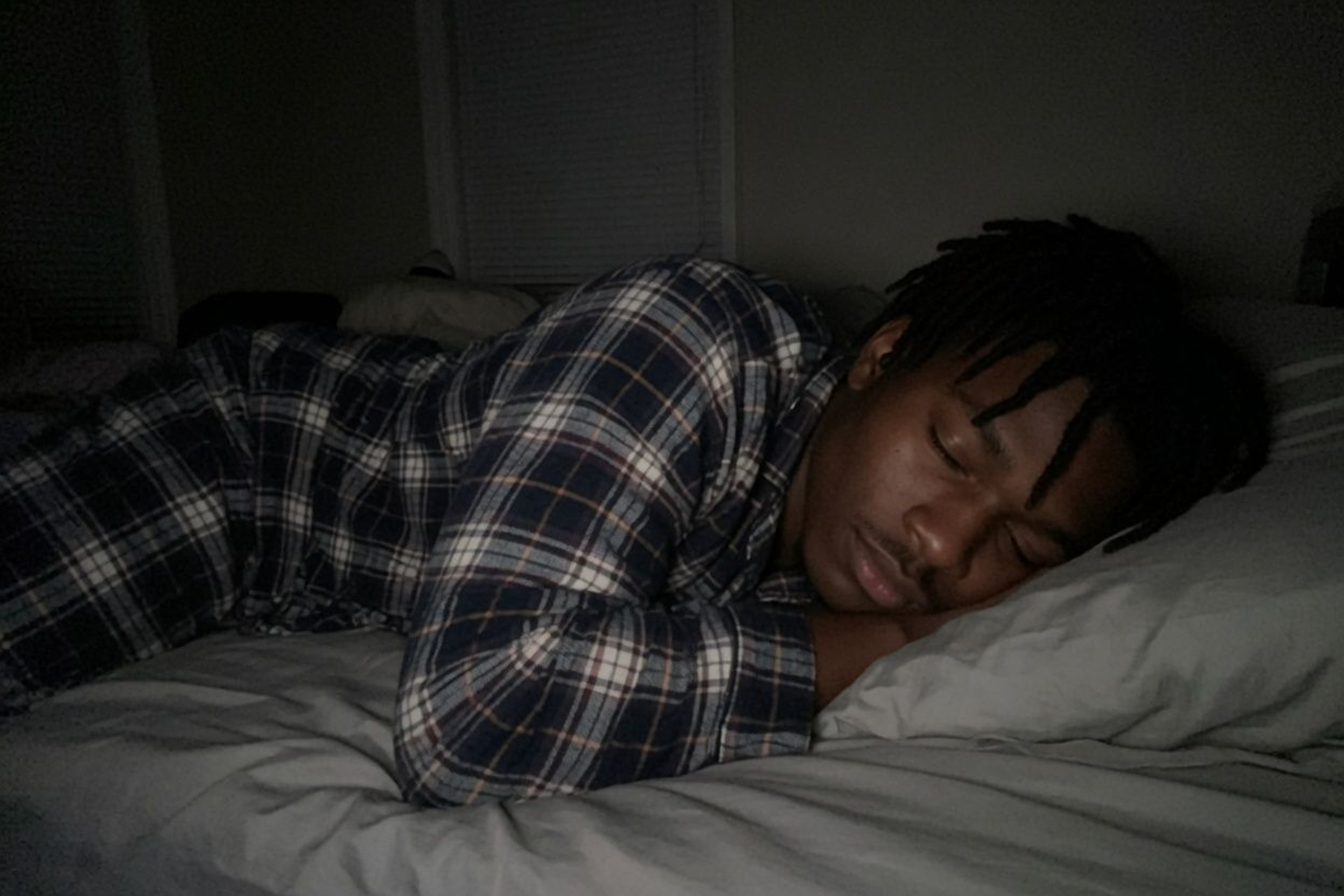 Person sleeping in bed after apps lock at bedtime