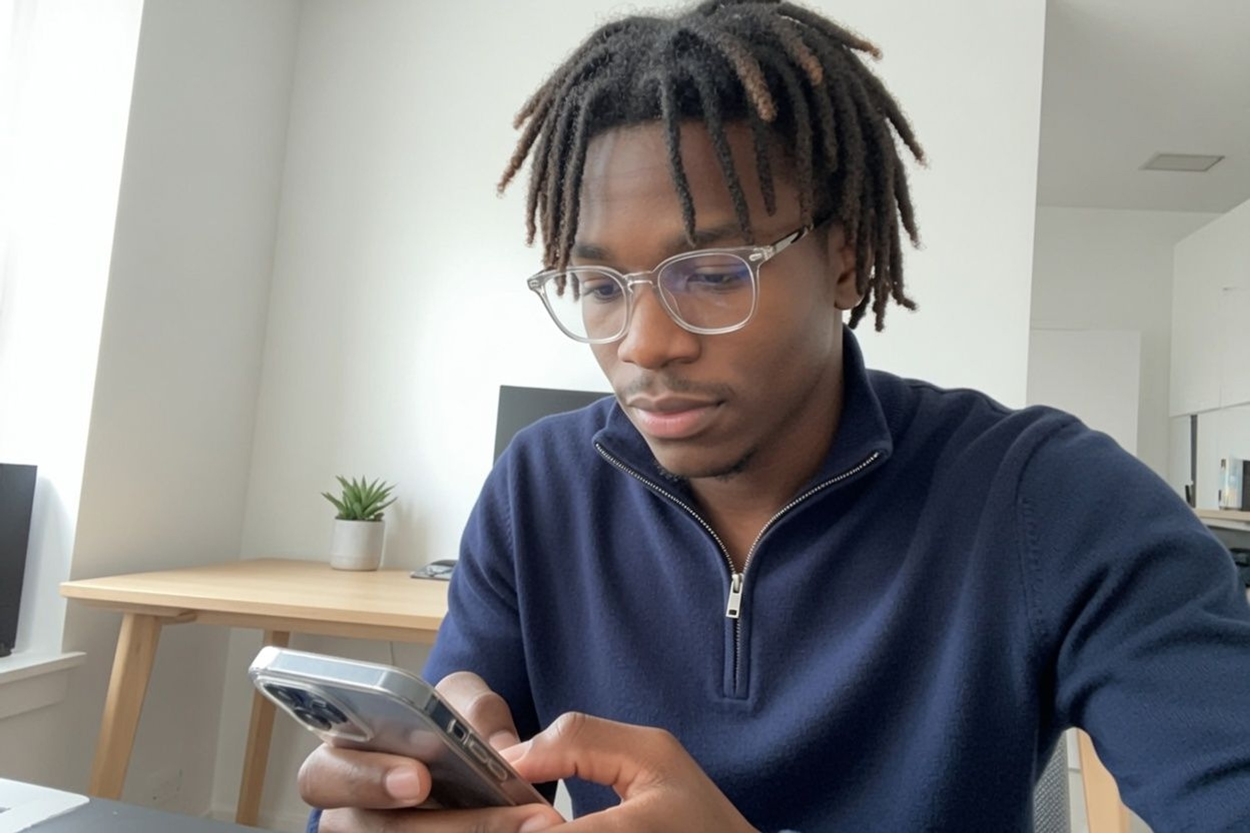 Person setting a wake-up routine on an iPhone